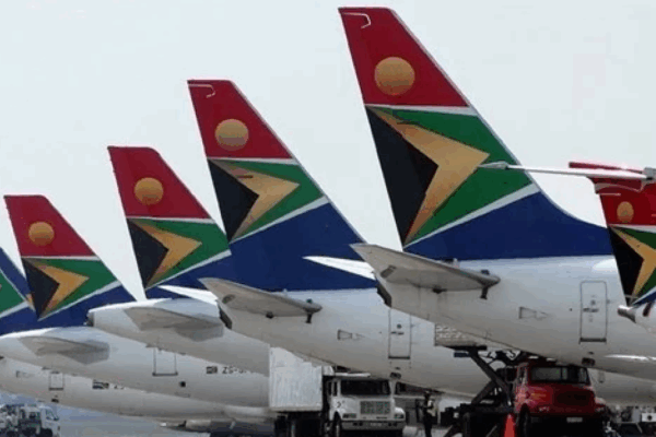 South African Airways plane taking off at O.R. Tambo International Airport, showcasing new domestic and regional routes.